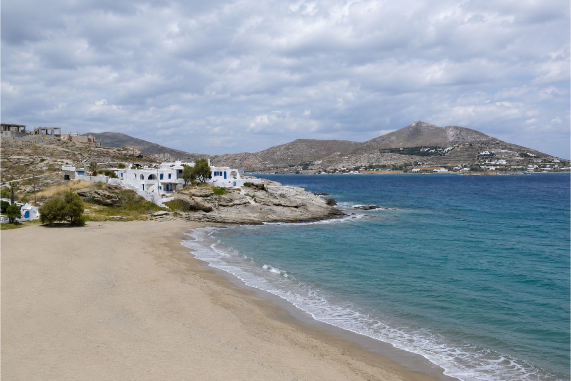 Beautiful seaside landscape of Naxos Town with crystal-clear Aegean waters explored during a guided tour with Mykonos Tours